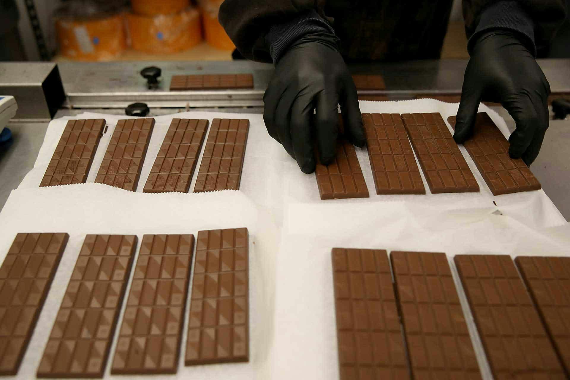 <p>A worker prepares to package freshly made marijuana infused chocolate bars at Kiva Confections on January 16, 2018 in Oakland, California. Less than one month after recreational marijuana sales became legal in California, dispensaries are reporting a shortage in pot edibles. The number of manufacturers in the state has been reduced by nearly two thirds due to new regulations and state approved potency levels. (Photo by Justin Sullivan/Getty Images)</p>
