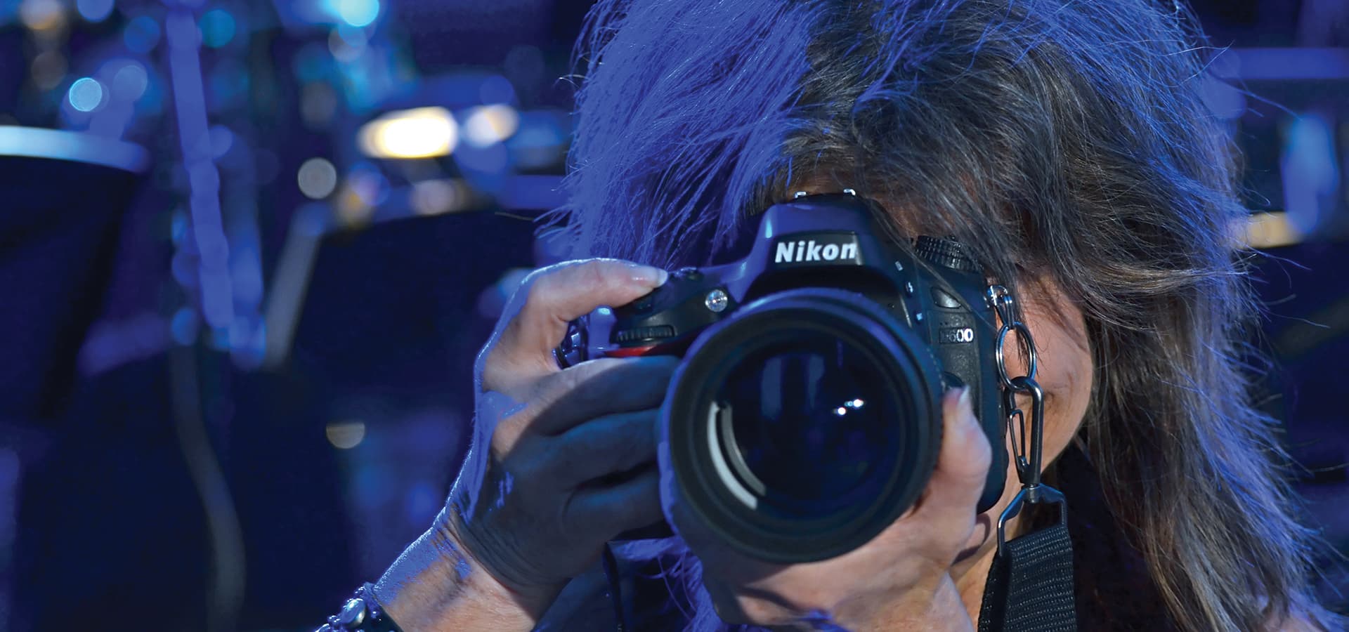 <p><span style="color: #999999; font-family: Montserrat, Helvetica, Arial, sans-serif; font-size: 16px; line-height: 24px;">Sherry on the job, with one of the half dozen cameras she owns. </span></p>